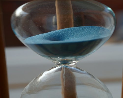 symbolic image of hourglass and aging process